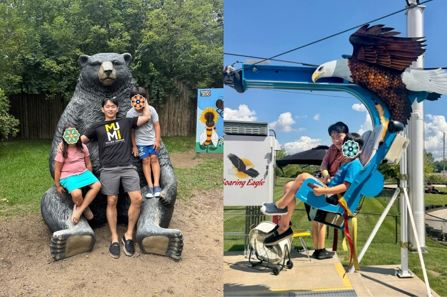 Two children sit on a large bear-shaped statue and smile for a photo, and another child rides an eagle-themed playground sculpture on a sunny day. Faces are covered.