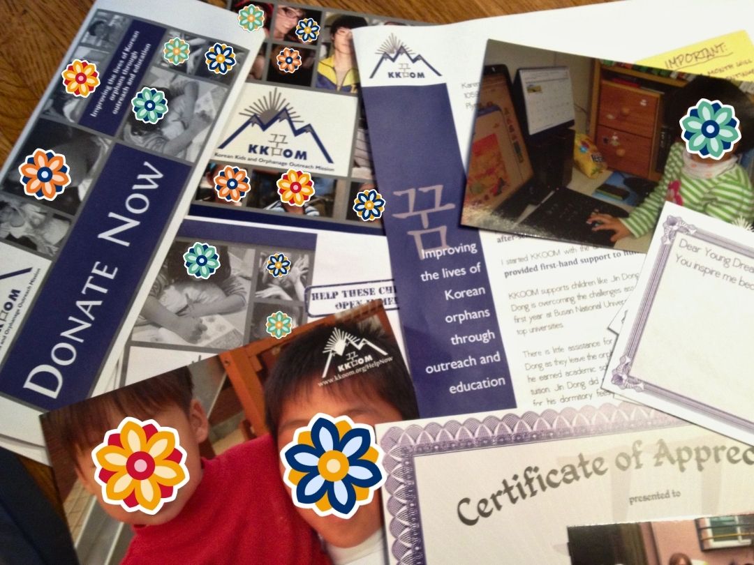 KKOOM certificates, bookmarks, and donation materials highlighting early organizational milestones.