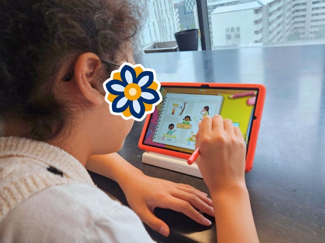 Student using a tablet during a KKOOM GEM Program event.